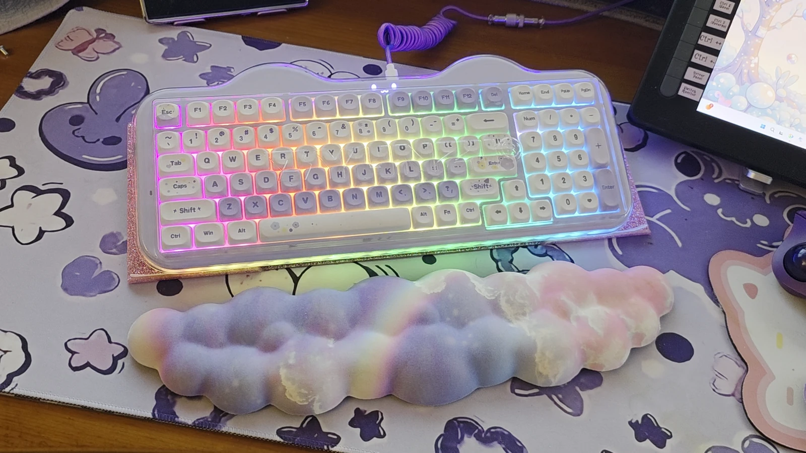 Purple YUNZII C98 Meow Cake keyboard under its clear dust cover on Dr. Elena’s desk