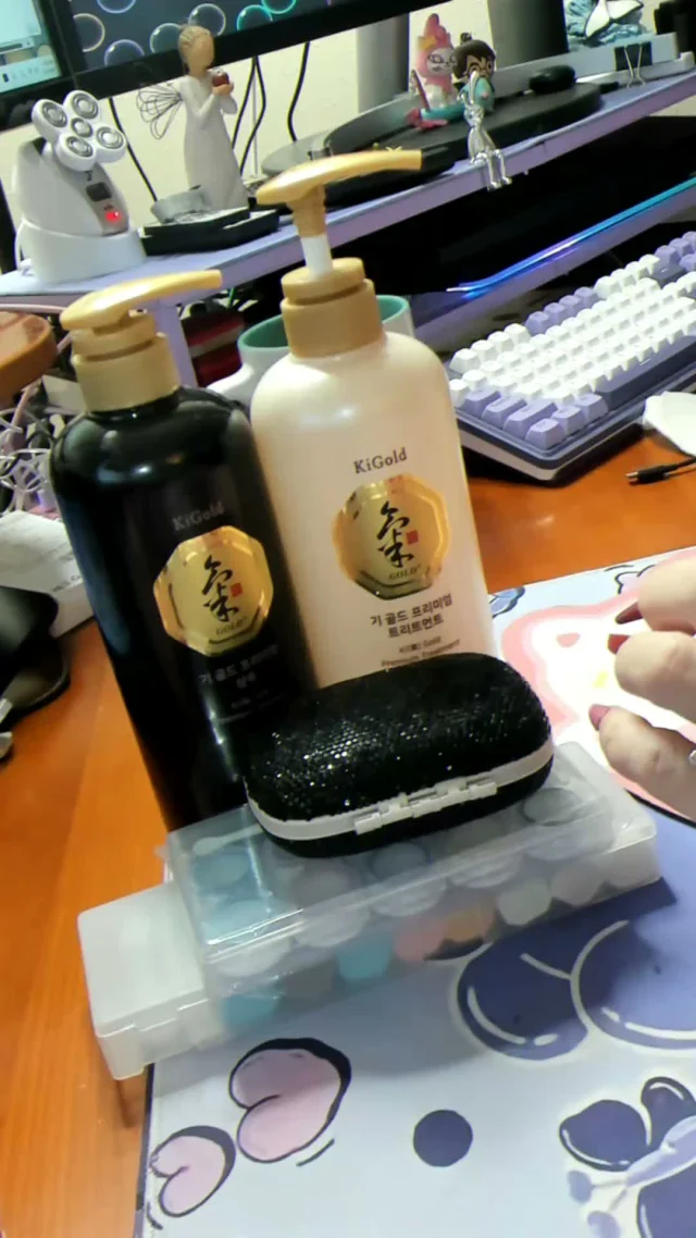 Dr. Elena’s black Ki Gold shampoo bottle and cream treatment bottle on her desk.